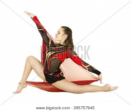 Flexible Equilibrist Performs Exercises On Acrobatic Walking Sticks.