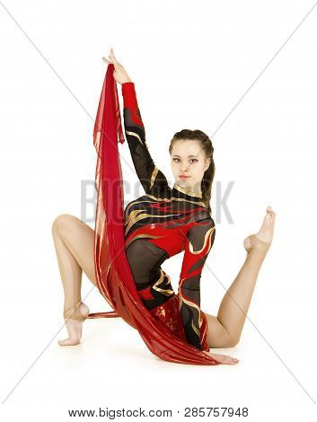 Flexible Equilibrist Performs Exercises On Acrobatic Walking Sticks.