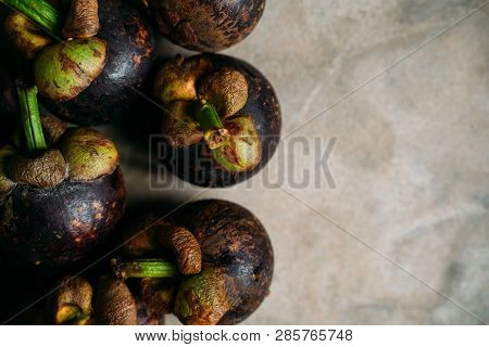 Fresh Mangostine. Fresh Tropical Fruits. On A Grey Background. Top View.