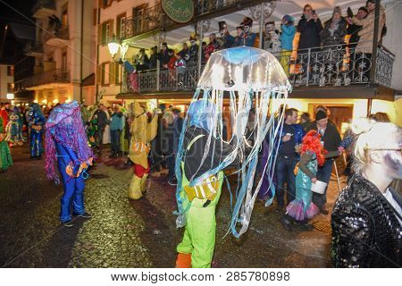 Participants In Costumes Perform A Street Procession At The Carnival