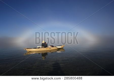 Key Biscayne, Florida 01-16-2016 Kayaker Enjoys A Bright Fogbow Ober Biscayne Bay On A Calm, Foggy M