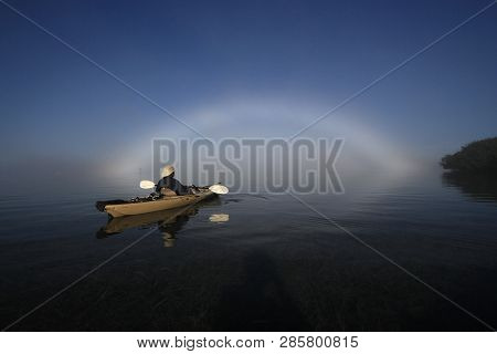 Key Biscayne, Florida 01-16-2016 Kayaker Enjoys A Bright Fogbow Ober Biscayne Bay On A Calm, Foggy M