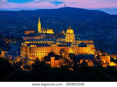 Illuminated Budavari Palace In Budapest At Summer Sunset