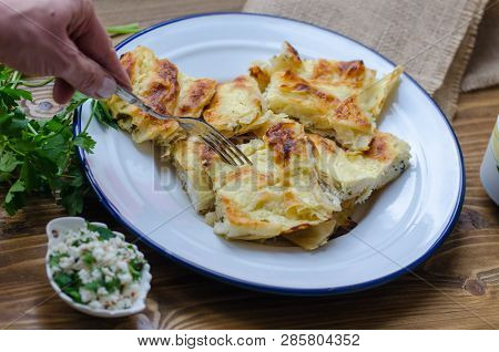 Traditional Turkish Borek On Wooden Table.