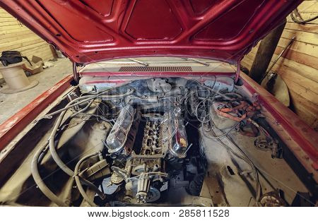Restoration Of Classic Red Car. Close Up View Front Side Classic Car And  Motor Or Engine Of  Broken