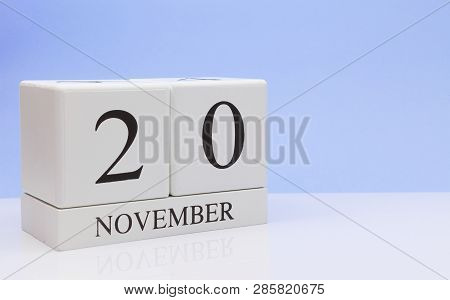 November 20st. Day 20 Of Month, Daily Calendar On White Table With Reflection, With Light Blue Backg