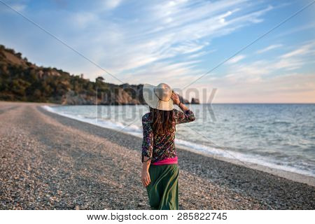 
Young woman walking on the beach, Cala del CaÃ±uelo, Andalusia, Spain