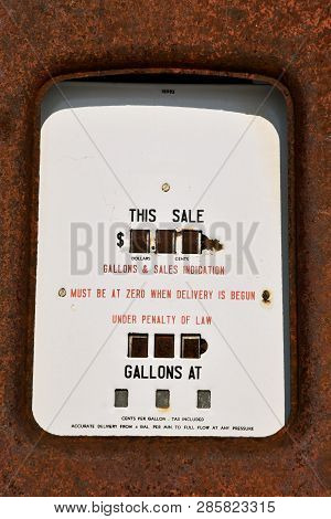 An Old Rusty Gas Pump Gauge Which Recorded Gallons Pumped And Cost Per Gallon