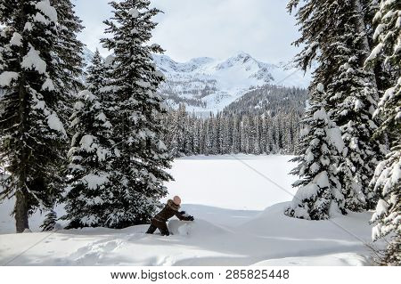 A Young Woman Having Fun Around Island Lake In Fernie, British Columbia, Canada.  The Majestic Winte