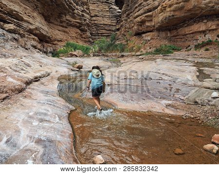 Young Woman Enjoys Some Downtime In Hermit Creek During A Multi-day Backpacking Expedition On The He