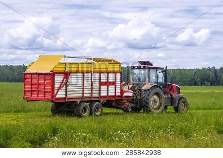 Tractor For Harvesting With A Silage Cart