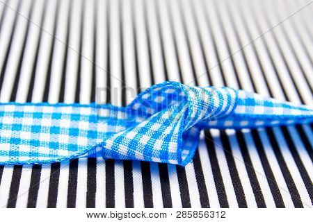 Birthday Gift Black And White Textured Card Background With Blue Bow In The Middle Of Decoration And