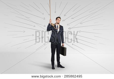 Hopeless young businessman trying to suicide with question signs concept