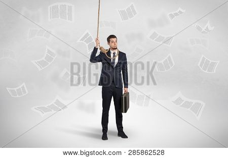 Young burnout businessman with flying documents concept