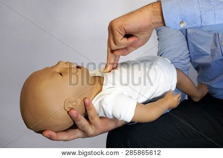 Performing Cpr On A Simulation Mannequin Baby Dummy During Medical Training Pediatric Basic Life Sup
