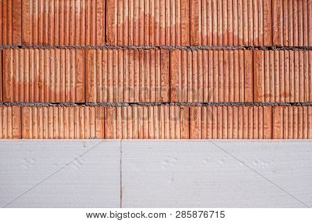 Red Brick Wall During The Works Connected With The Insulation Of Polystyrene