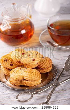 Fresh Tasty Cookies And Hot Tea On The Table