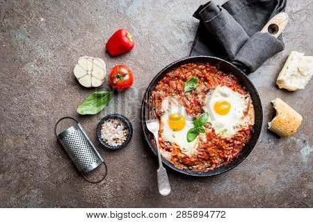 Shakshuka, Fried Eggs In Tomato Sauce In Iron Frying Pan. Typical Israel Food. Top View.