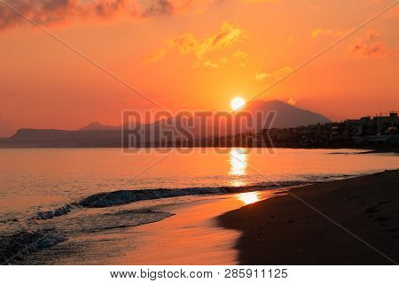 Morning On The Beach Near The Sea. Crete, Retimno. Beautifull Sunrise On The Beach Line.