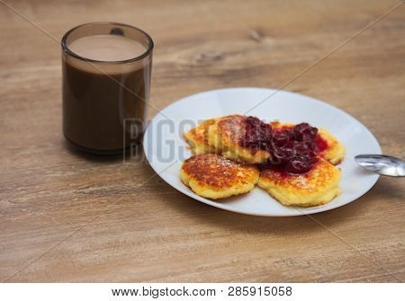 Cottage сheese Pancakes With Fried Crust With With  Coffee On Wooden Background