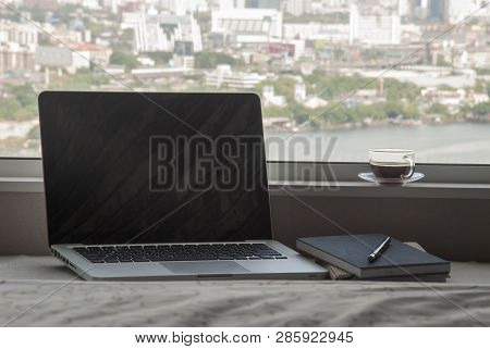 Relaxing Work Area By The Bedroom Window With Half A Cup Of Coffee