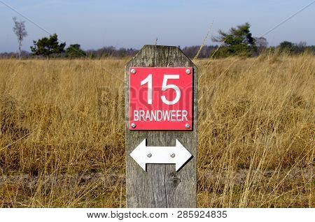 Mierlo, The Netherlands - February 16, 2019: Dutch Fire Brigade Direction Sign On A Pole At Dutch He