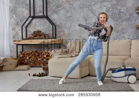 Full Length Portrait Of Cheerful Young Woman 20s Listening To Music Via Headphones And Having Fun Wi