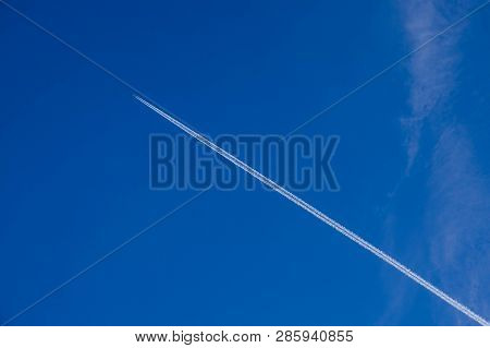 A Blue, Slightly Cloudy Sky.
Blue Sky, Slightly Cloudy. The Sky Is Covered By A Thin Layer Of White 