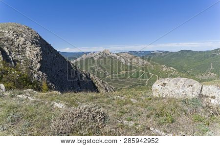 View Of The Vineyards In The Valley From The Top Of The Ridge. Crimea, Tokluk Mountain Range, Sunny 