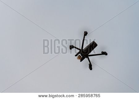 Drone Aka Unmanned Airborne Vehicle Taking Aerial Pictures And Videos