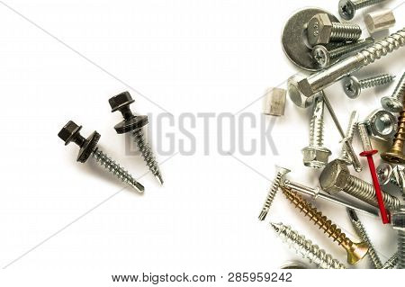 Flat Lay Of Self Drilling Screws For Roofing With A Drill And With Sealing Washer Isolated On White.