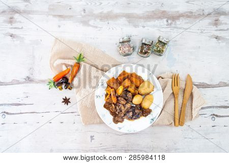 Beef meat stewed with potatoes-Traditional French cuisine Beef Bourguignon potatoes carrots in persillade
