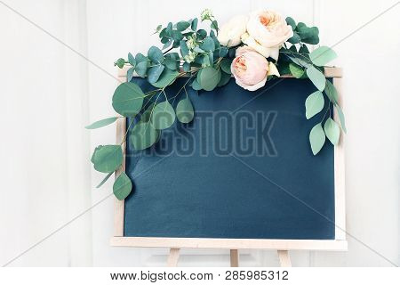 Blank Wedding Chalkboard Sign Mockup Scene. Floral Garland Of Green Eucalyptus Branches And Apricot 