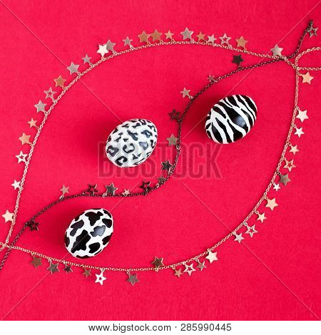 A Set Of Easter Eggs Painted As A Zebra, A Cow, A Snow Leopard On A Red Background With Gold And Sil