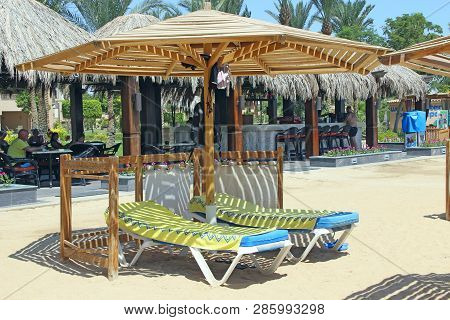 Hurghada / Egypt. 31 July 2018:empty Deck Chairs With Towels On Tropical Resort Beach. Pair Of Chais