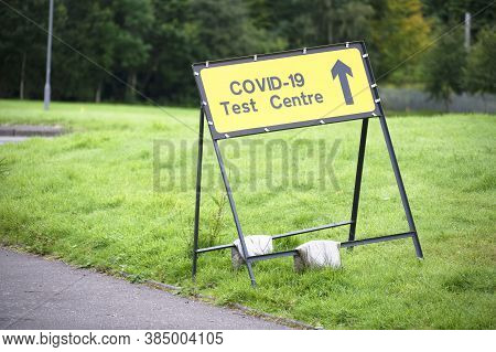 Covid-19 Test Centre Sign At Road With Traffic Cones