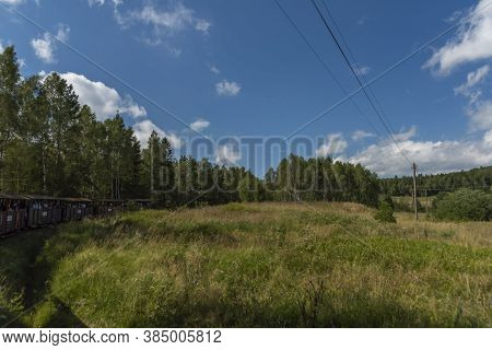 Narrow Gauge Railway Near Balnica Station In Poland Mountains In Summer Evening