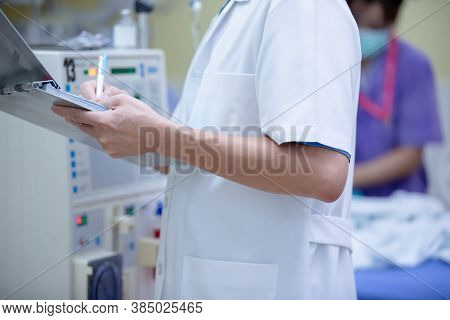 The specialist are doing continuous renal replacement therapy equipment and injection pump.