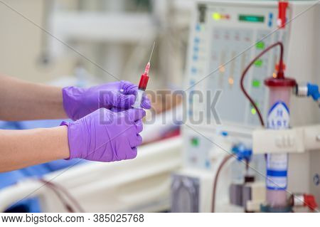 The Specialist Are Doing Continuous Renal Replacement Therapy Equipment And Injection Pump.