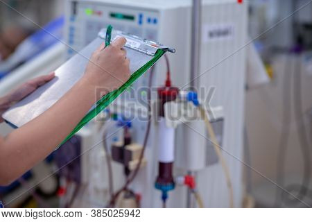 The Specialist Are Doing Continuous Renal Replacement Therapy Equipment And Injection Pump.