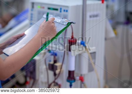 The Specialist Are Doing Continuous Renal Replacement Therapy Equipment And Injection Pump.