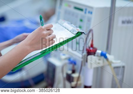 The Specialist Are Doing Continuous Renal Replacement Therapy Equipment And Injection Pump.