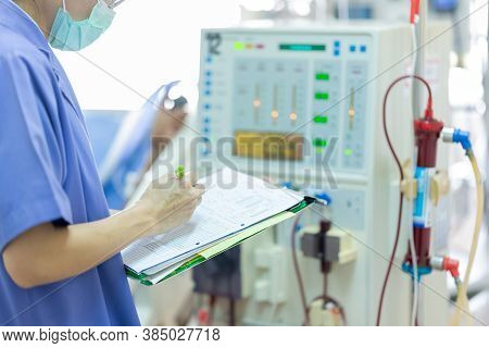 The Specialist Are Checking Continuous Renal Replacement Therapy Equipment And Injection Pump And He