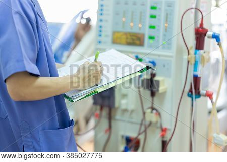 The Specialist Are Checking Continuous Renal Replacement Therapy Equipment And Injection Pump And He