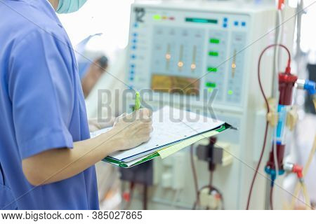 The Specialist Are Checking Continuous Renal Replacement Therapy Equipment And Injection Pump And He
