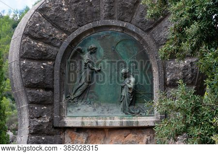 Lluc, Balearic Islands/spain; September 2020: Religious Sculpture Relief Made In Bronze On The Annun