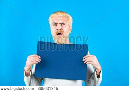 Man Holding A Blank Billboard Isolated On Background. Copyspace. Business Man Showing Thumb Up Holds