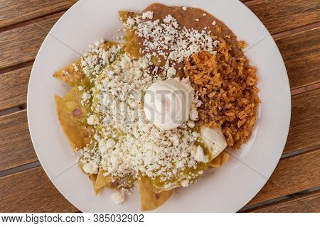Large Plate Of Chilaquiles With Rice And Beans Makes A Delicious Mexican Food Meal When Hungry.