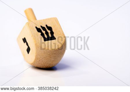 Dreidel or dreydl on blue background. High quality photo