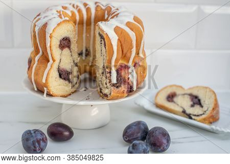 German Gugelhupf Cake Filled With Poppy Seeds And Plums